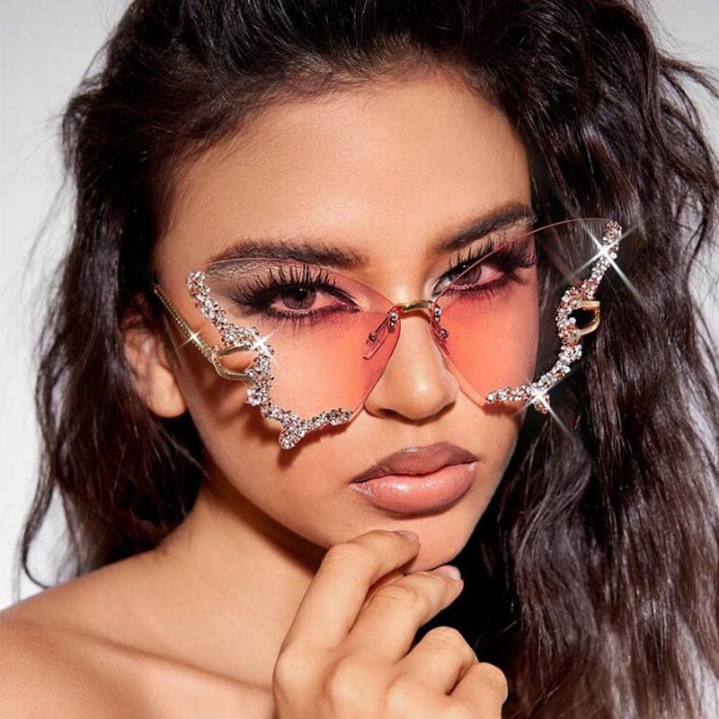 Butterfly-shaped sparkling rhinestone-rimmed sunglasses