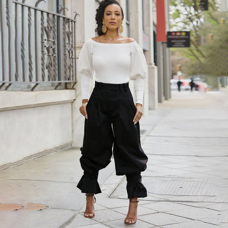 High-waisted loose-fit ruffled trousers