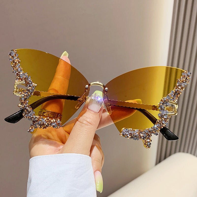 Butterfly-shaped sparkling rhinestone-rimmed sunglasses