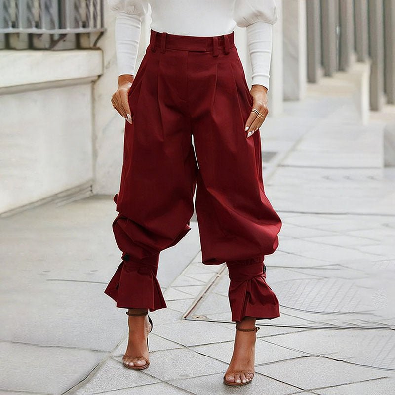 High-waisted loose-fit ruffled trousers