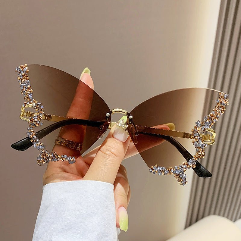 Butterfly-shaped sparkling rhinestone-rimmed sunglasses