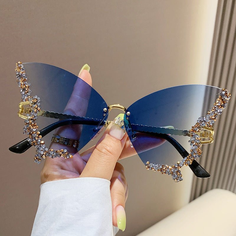 Butterfly-shaped sparkling rhinestone-rimmed sunglasses