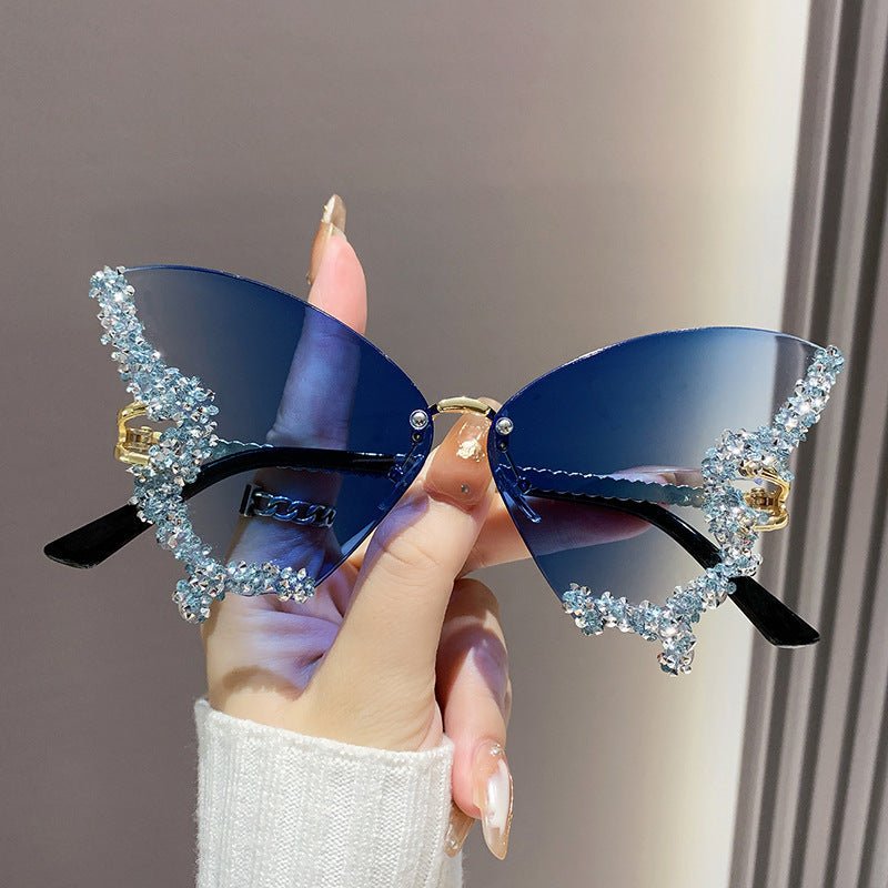 Butterfly-shaped sparkling rhinestone-rimmed sunglasses